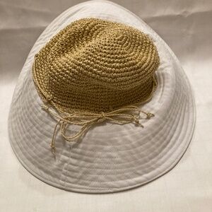 Obagi Beige tweed with white wide brim sun hat.